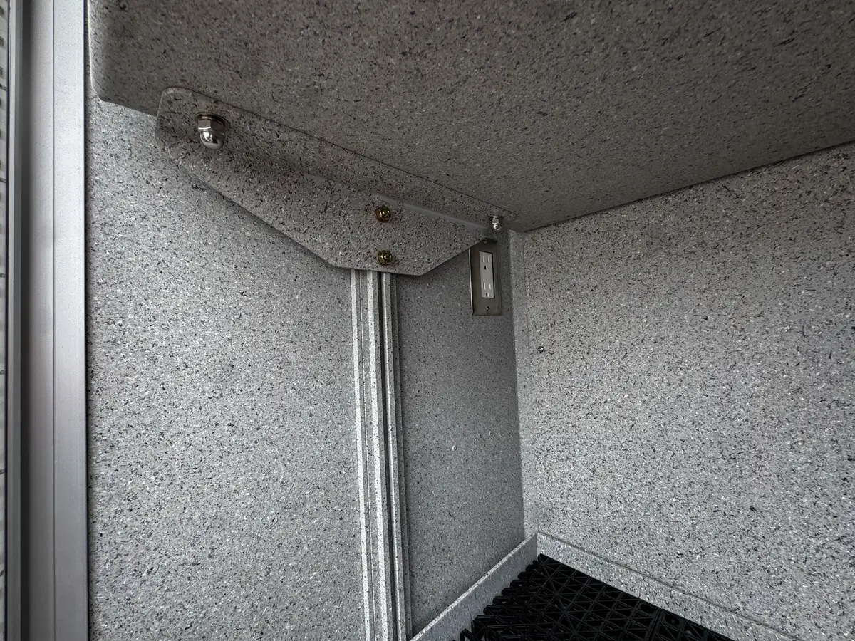 Rear center body compartment open view with shelf and door hardware.